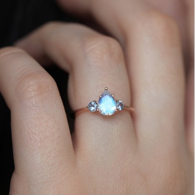 Pear Rainbow Moonstone Ring With Light Blue Sapphires
