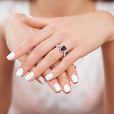 1 1/2 Carat Garnet and Halo Diamond Vintage Ring In 14 Karat White Gold