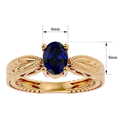 1 1/2 Carat Oval Shape Sapphire Ring With Tapered Etched Band In 14 Karat Yellow Gold