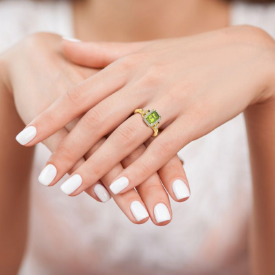 1 1/2 Carat Peridot and Halo Diamond Vintage Ring In 14 Karat Yellow Gold